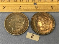 A pair of Morgan silver dollars: 1878S and 1900