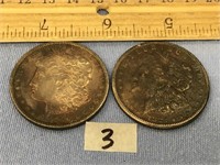 A pair of Morgan silver dollars: 1890O and 1921S