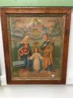 A very old print of the Holy Family in a very orna