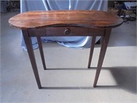 Antique wooden desk with small drawer