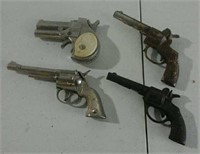 Four small cap guns