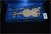Silver filigree model of a violin complete with