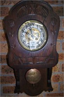 Art Nouveau wall clock, carved oak case,