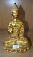 Gilt bronze seated Buddha on platform throne with