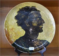 Large studio pottery platter with glazed portrait