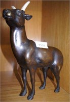 Bronze model of a mountain goat, carved bone