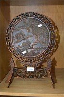 Carved Chinese wooden disc on stand with cranes in
