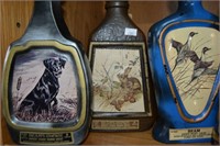 3 Jim Beam decanters with various themes including