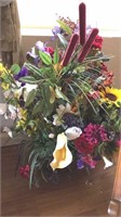 Artificial flower arrangement in vase or basket