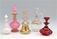 Five antique cut glass bottles