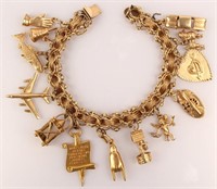 14K YELLOW GOLD WORLD TRAVELER CHARM BRACELET