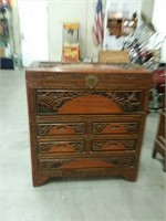 Asian  cabinet with spring loaded drawers