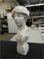 An outsider artists plaster bust of a woman's head