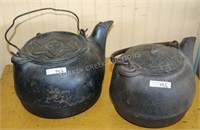 2 CAST IRON KETTLES, 1 SIGNED