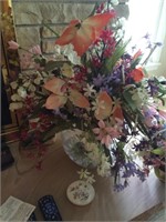 Silk floral arrangement in large glass vase -