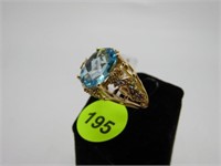 14K YELLOW GOLD RING WITH LIGHT BLUE SAPPHIRE CENT