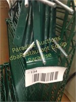 green shelf with set of brackets and extra shelf
