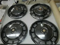 Four vintage classic car hubcaps, look pretty