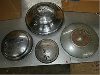 Collection of 3 assorted classic Ford hubcaps and