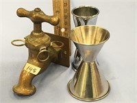 Faux brass spigot and two silver colored shot glas