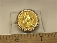 One stamped "375" karat, yellow gold men's coin ri