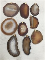 Lot of 9 brown agate slabs, made into pendants   (