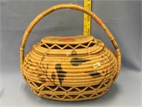 Oval shaped highly unusual lidded grass basket wit