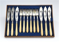 Victorian silver fish set with carved handles