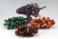 Four bunches of hardstone grapes