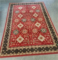 ABOUT 5X 8 RED AND GOLD AREA RUG