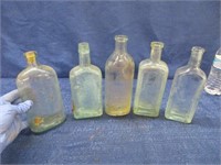 5 antique bottles - embossed advertising