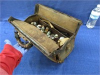 antique doctor's case full of medical bottles