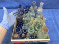 35 antique bottles - many smaller embossed