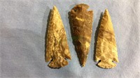 Three large carved stone arrowheads , 4 inches