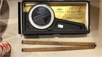 A pro inclinometer in the original box and a