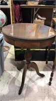 Walnut pedestal table with a glass top, 27 x 20"
