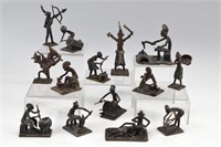 Fourteen African cast iron figural sculptures