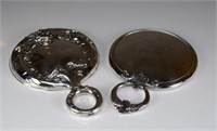 Two silver vanity mirrors