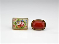 Two antique pins with floral motif and carnelian