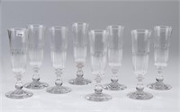 Eight Georgian cut glass champagne flutes