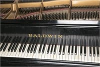 Baldwin 9' concert grand piano.