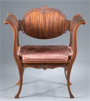 Art Nouveau curved arm chair.