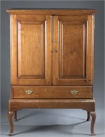 American country Queen Anne cabinet on stand.