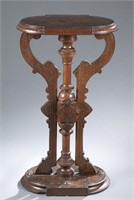 Eastlake carved wood and burl veneer pedestal.
