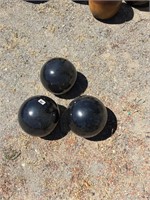 Trio of Metallic Dark Spheres