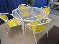 vintage patio table & yellow mesh chairs
