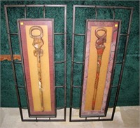 2- Carved African walking sticks, framed