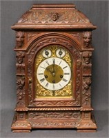 Heavily Carved Oak Junghans Mantel Clock