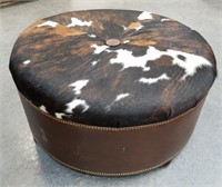43IN DIAMETER COWHIDE / LEATHER OTTOMAN