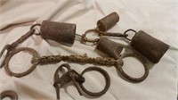 Rusty Tin Bells chained together, horse bit